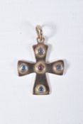 A YELLOW METAL CROSS PENDANT, polished cross set with a central garnet cabochon and four blue