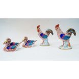 Four Herend porcelain animal figures, 20th century, comprising: a cockerel, with red fishnet design,