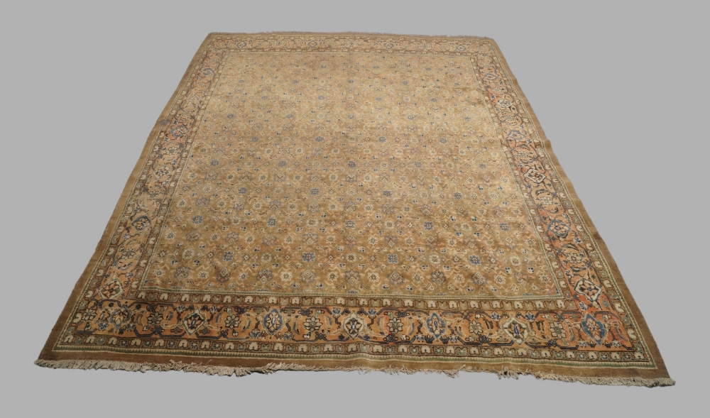 A Persian Moud carpet, mid to late 20th century, central repeating geometric floral motifs, on a