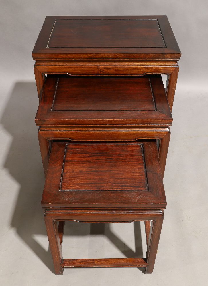 A Chinese hardwood nest of three tables, 20th century, 61cm high, 50cm wide, 36cm deep (3)light - Image 3 of 3