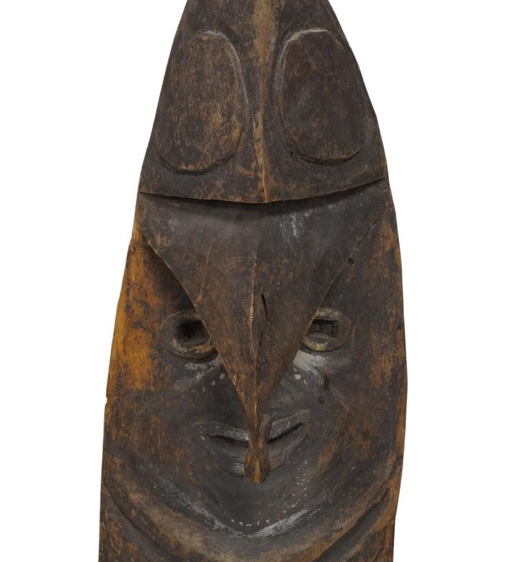 A Sepik wooden shield, Papua New Guinea, Melanesia, carved with a face and having overhanging, - Image 3 of 4