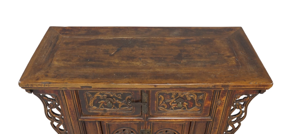 A Chinese elm side cabinet, early 20th century, the rectangular top above two drawers, carved with - Image 2 of 4