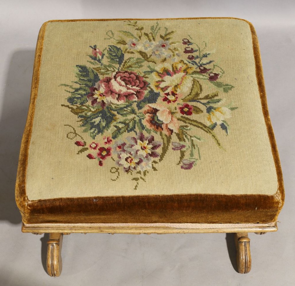 A Victorian mahogany X-framed stool, circa 1860, with floral needlework seat, 42cm high, 56cm - Image 2 of 2