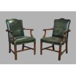 A pair of George III style mahogany Gainsborough armchairs, 20th century, with brass stud bound