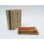 Two Japanese books, Meiji period, containing woodblocks prints of Mons motifs, the covers with