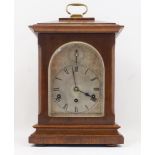 An Edwardian oak bracket clock, the silvered face and dial with Roman hours and subsidiary Chime/