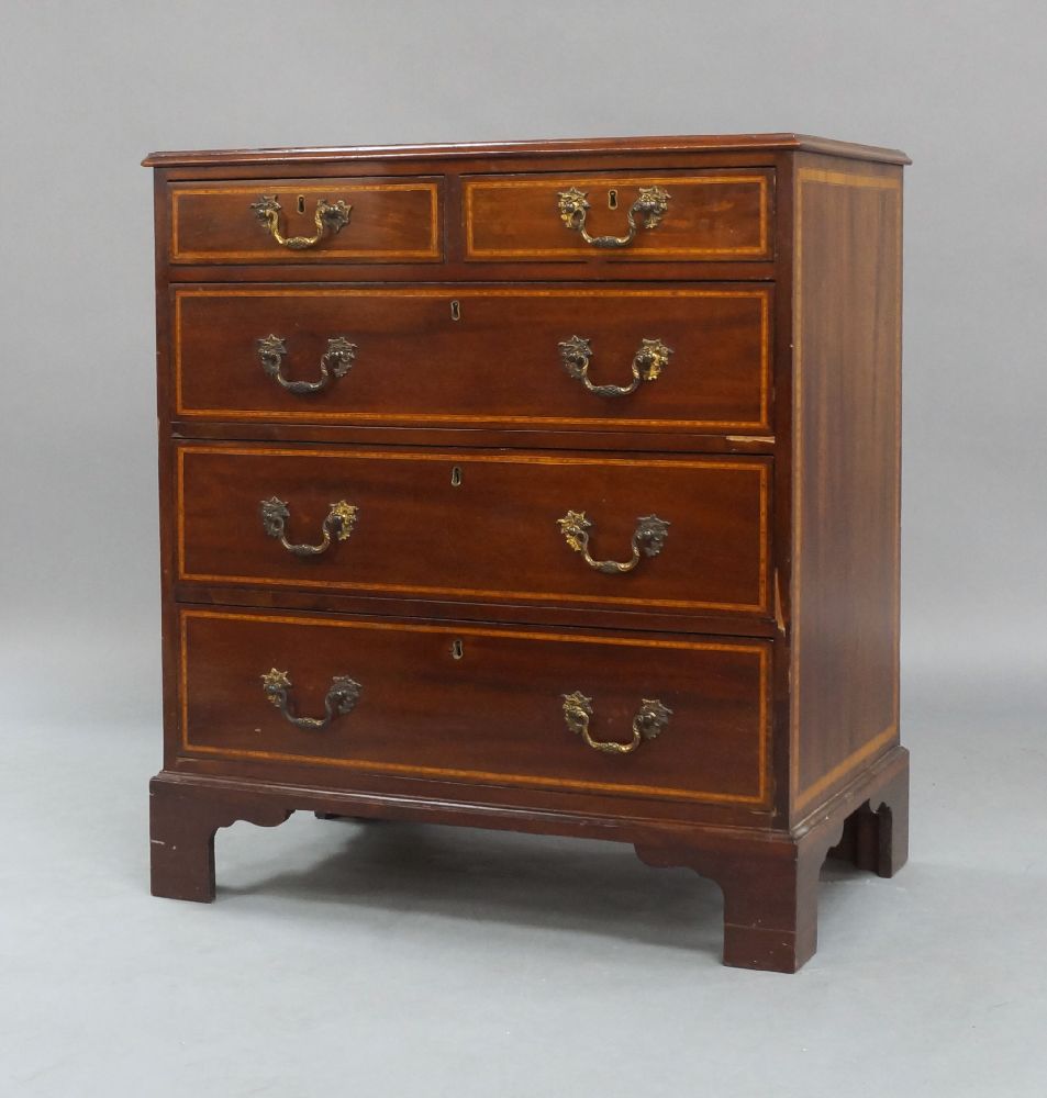 A George III style mahogany chest of drawers, early 20th century, satinwood crossbanding, two