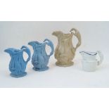 Three relief moulded jugs, each with a continuous frieze of game, the handles in the form of