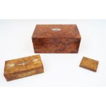 Three Russian Karelian birch boxes, 20th century, to include a brass hinged box with niello plaque