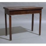A George III mahogany fold over tea table, circa 1790, the rectangular hinged top raised on