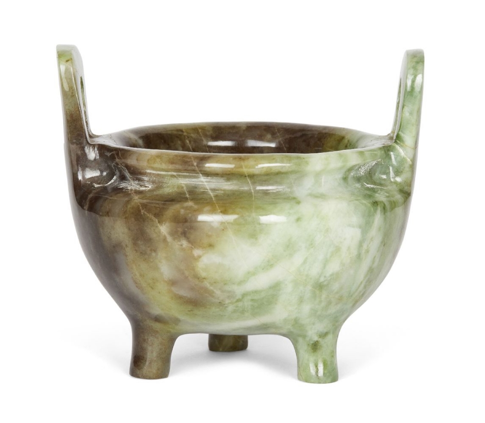A Chinese green hardstone archaistic censer, mid-20th century, with high loop handles raised on