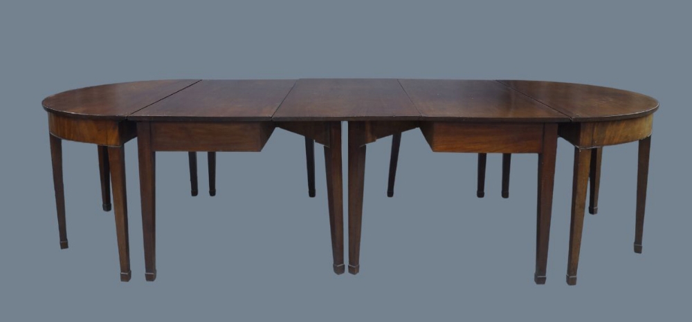 A George III and later mahogany D-end dining table, raised on tapered legs and spade feet, 74cm