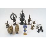 A group of five variously decorated bronze peacocks, a wooden painted peacock, a bronze covered