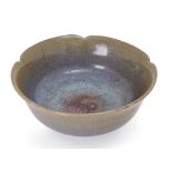 A Chinese Jun-type floral bowl, Republic period, covered in a lavender glaze thinning to mushroom