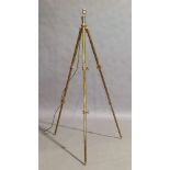A brass and copper adjustable tripod standard lamp, 20th century, etched and stamped with makers