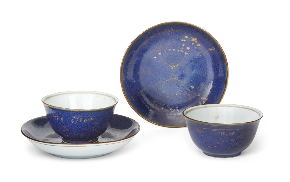 A pair of Chinese powder blue ground tea cups and saucers, 18th century, the saucer painted in