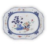 A large Chinese blue and white and famille rose meat platter, 18th century, painted with tree, rock,