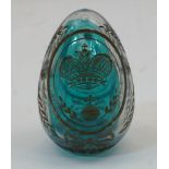 Russian Interest: A pale blue-tinted glass egg, late 19th / early 20th century, engraved and gilt