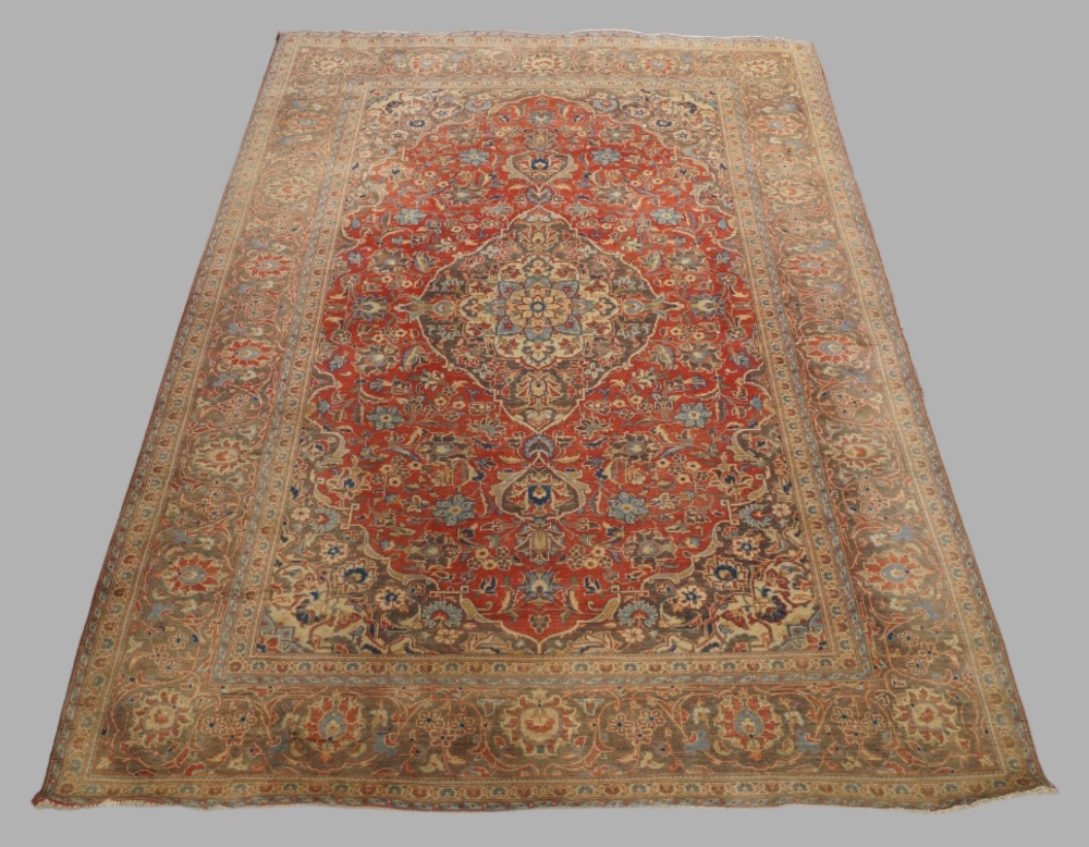 A Persian Kashan carpet, mid to late 20th century, central floral medallion surrounded by floral