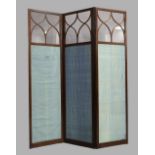 An Edwardian mahogany three fold screen, each panel with top glass section above silk lined panel,