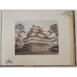 A Japanese lacquer photo album containing hand-coloured albumen prints of landscapes and