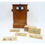 A Victorian mahogany table top stereoscope viewer, late 19th century, of pillbox form, with ebonised