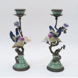 A pair of Continental gilt metal and porcelain candlesticks, with gilt metal stems in the form of