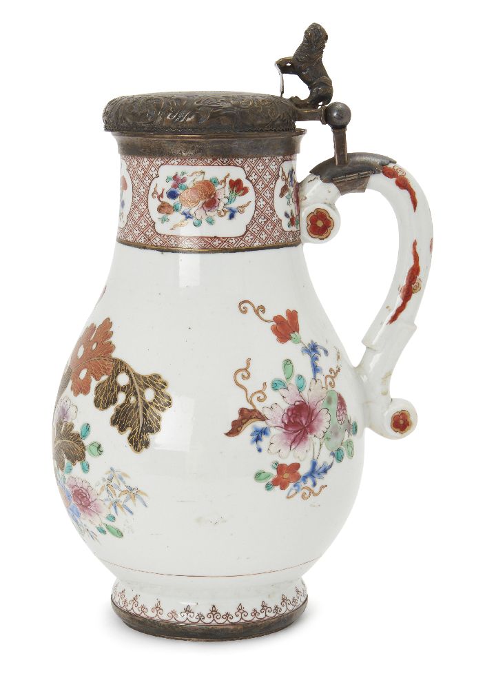 A Chinese famille rose silver-mounted baluster jug, Qianlong period, painted with flowering shrubs