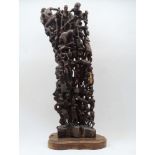 An East African 'Tree of Life' carved hardwood sculpture, by the Makonde people, late 20th