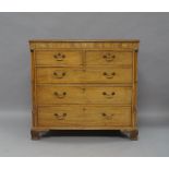 A George III mahogany chest of drawers, the frieze with marquetry inlaid butterfly and two shells,