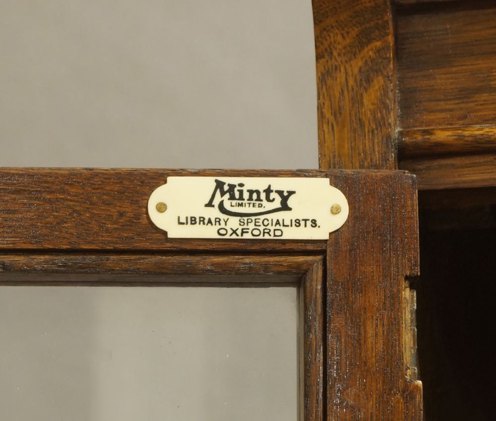 Minty of Oxford, an oak four section bookcase, early 20th century, with glazed doors, raised on - Image 2 of 2