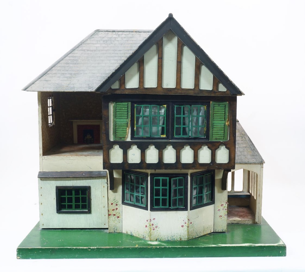 A Triang dolls house, mid 20th century, cream painted in mock Tudor timbers, with over hanging first - Image 2 of 2