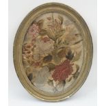 A collection of needlework panels, to include: an oval needlework panel depicting blossoming