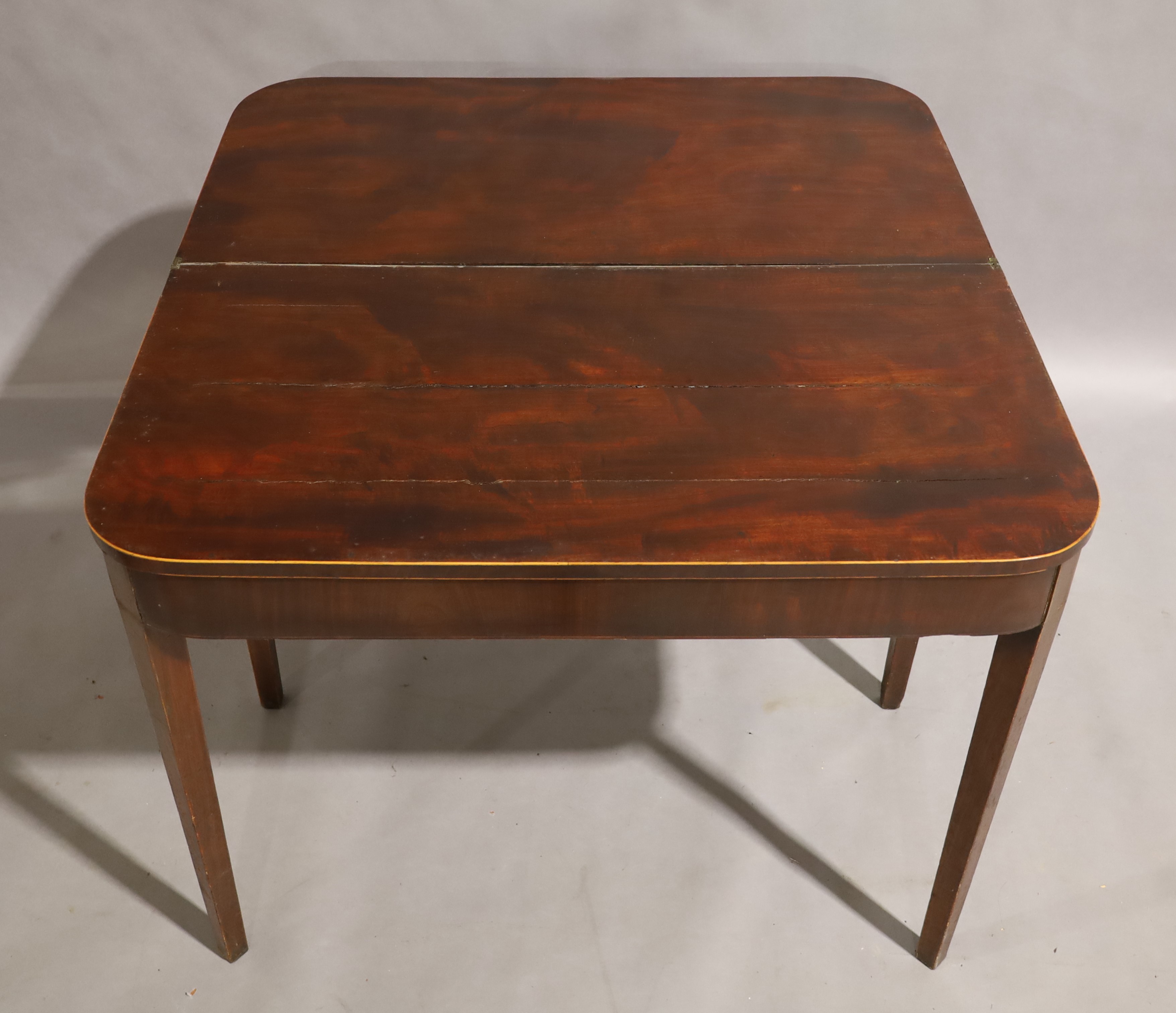 A George III mahogany fold over tea table, circa 1780, boxwood strung, raised on square tapering - Image 3 of 3