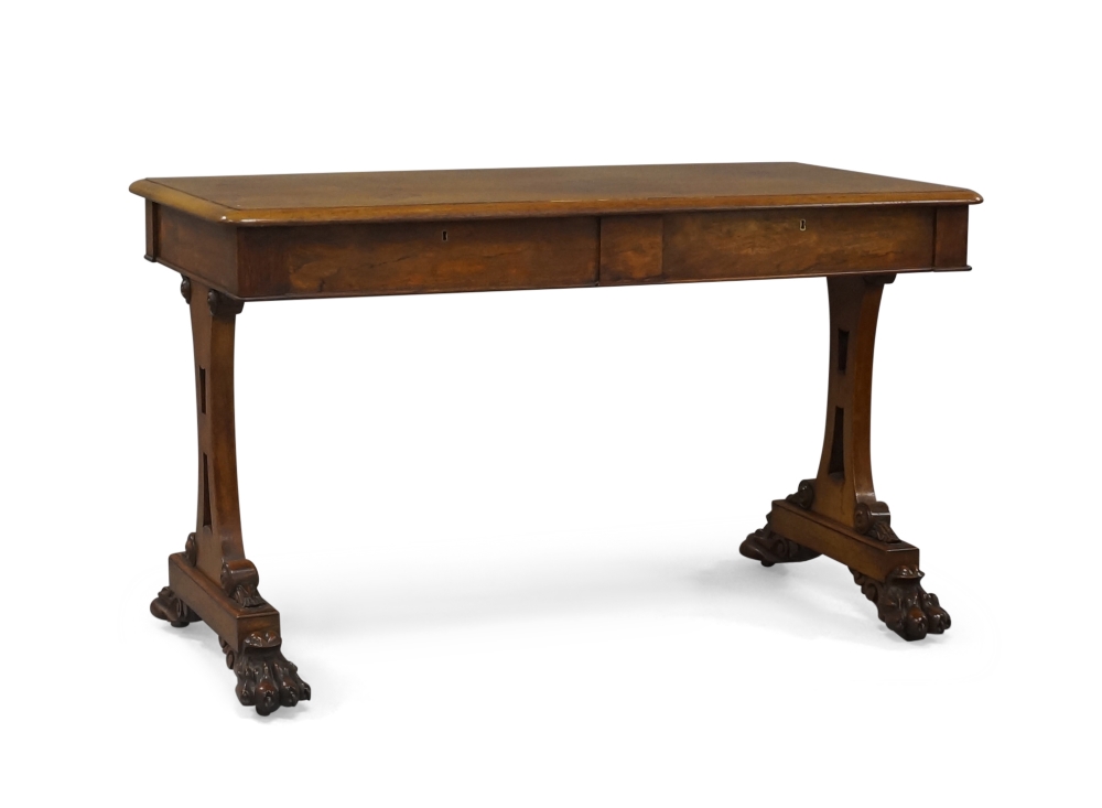 A William IV rosewood library table, the rectangular top above two frieze drawers and two dummy