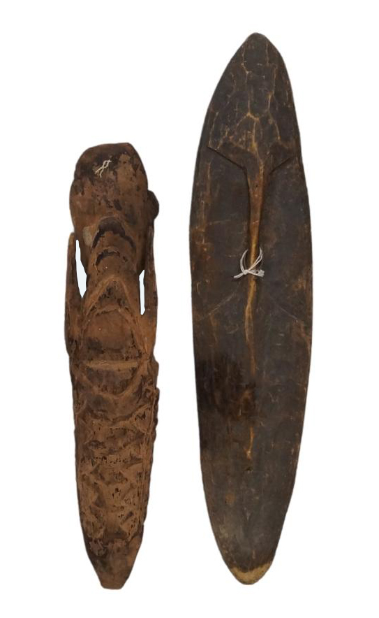 A Sepik wooden shield, Papua New Guinea, Melanesia, carved with a face and having overhanging, - Image 2 of 4