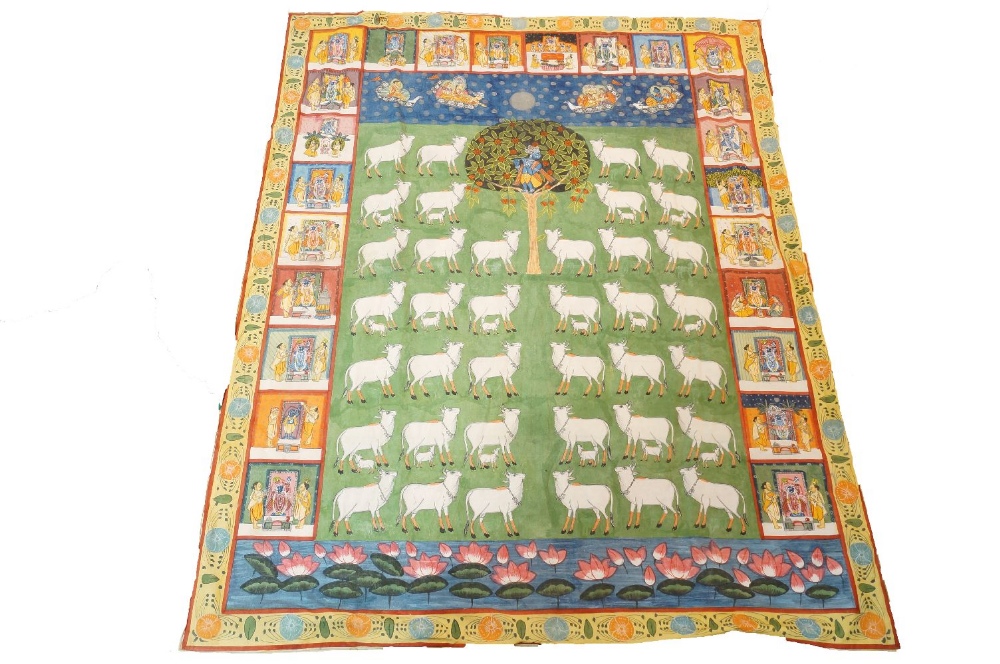 A modern Indian pitchwai, with Krishna fluting in a tree to centre surrounded by cows, within border