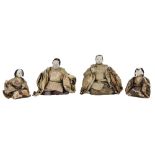 Four Japanese kneeling figures, Meiji period, comprising two men and two women, their heads of