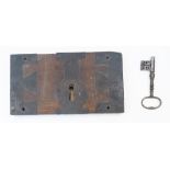 An oak and iron door lock and key, 18th century, 22cm high, 40.5cm wide Please refer to department