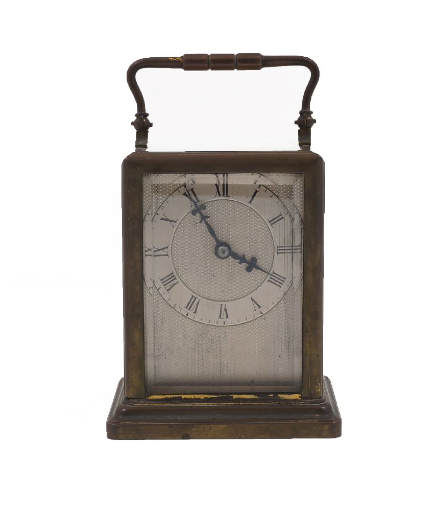 A French brass carriage timepiece, late 19th century, the brass case with swing handle and