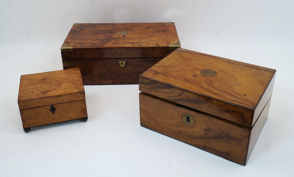 Two Victorian walnut brass bound writing boxes, the larger with inscribed brass shield plaque to the