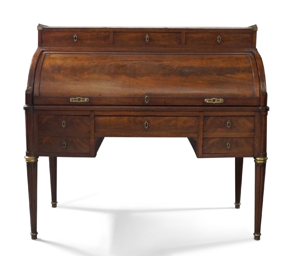 A French brass inlaid mahogany cylinder bureau, 19th century, the brass galleried white marble top