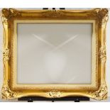 A Gilded Composition Louis XV Style Swept and Pierced Frame, mid-late 20th century, with leaf sight,