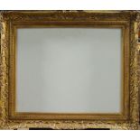 A Carved and Gilded Provincial Louis XIV Style Swept Frame, mid-20th century, with cavetto sight,