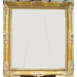 A Carved and Gilded Régence Style Frame, 20th century, with leaf ogee sight, sanded frieze, the