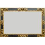 A Carved Parcel Gilded and Ebonised Spanish Style Plate Frame, late 20th century, with leaf and