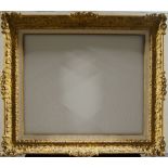 A Swiss Carved and Gilded Louis XIV Style Frame, late 20th century, with parcel gilded and linen