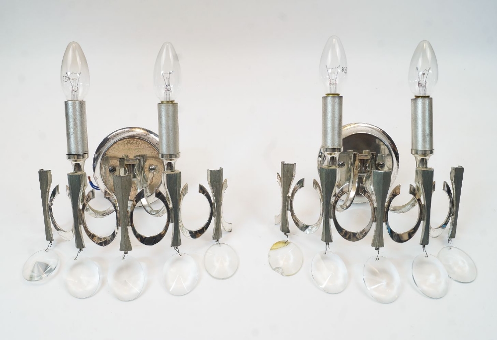 Gaetano Sciolari, a pair of white metal wall appliques, c. 1970s, with two light fittings, moulded