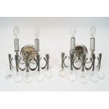 Gaetano Sciolari, a pair of white metal wall appliques, c. 1970s, with two light fittings, moulded