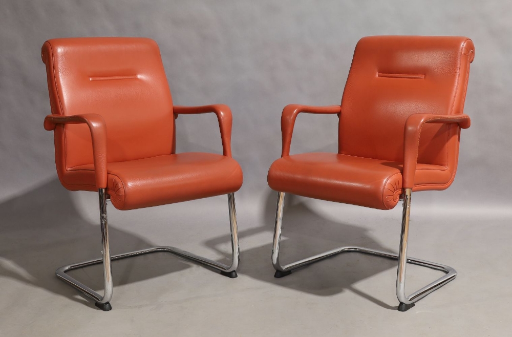 Poltrona Frau, a pair of cantilever armchairs, circa 1990, with vermillion leather seats on